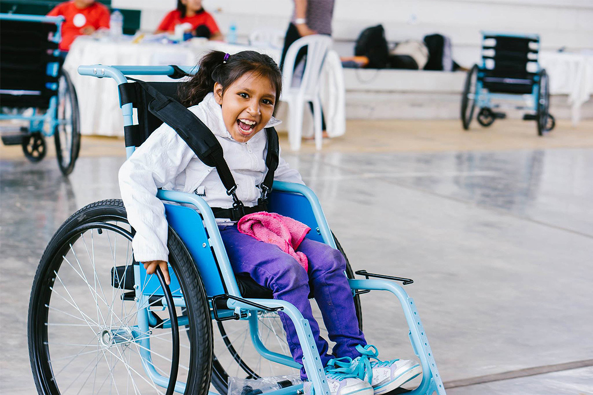 Free Wheelchair Mission — a young girl in her new wheelchair